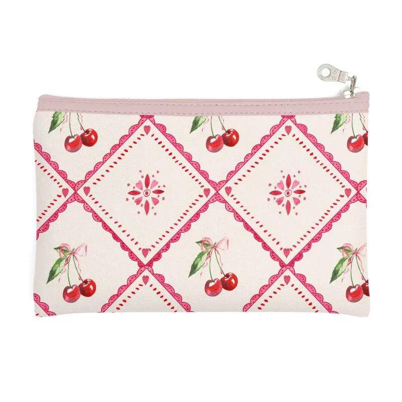 Make-up bag with zip top, cherry print and pink geometric pattern on white background