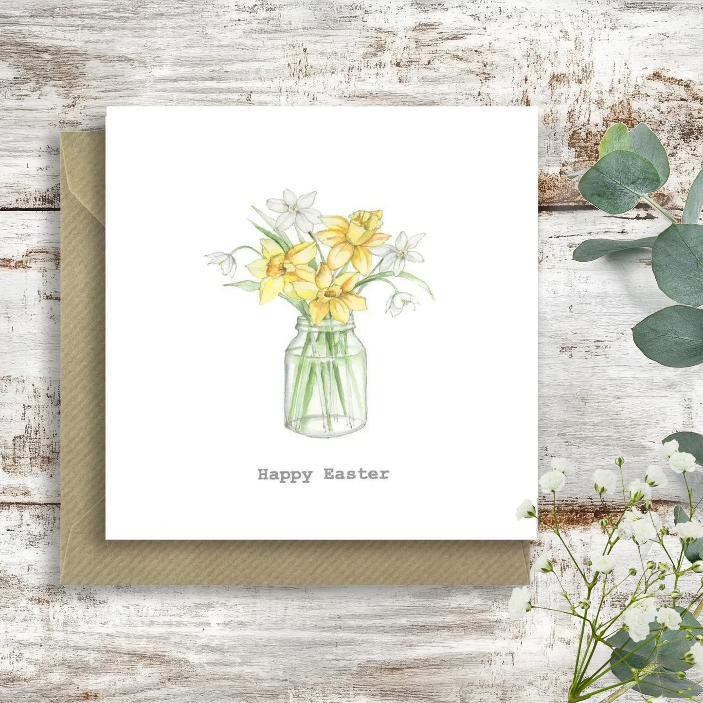 Happy Easter card with watercolor daffodils and snowdrops in a jar on rustic wood