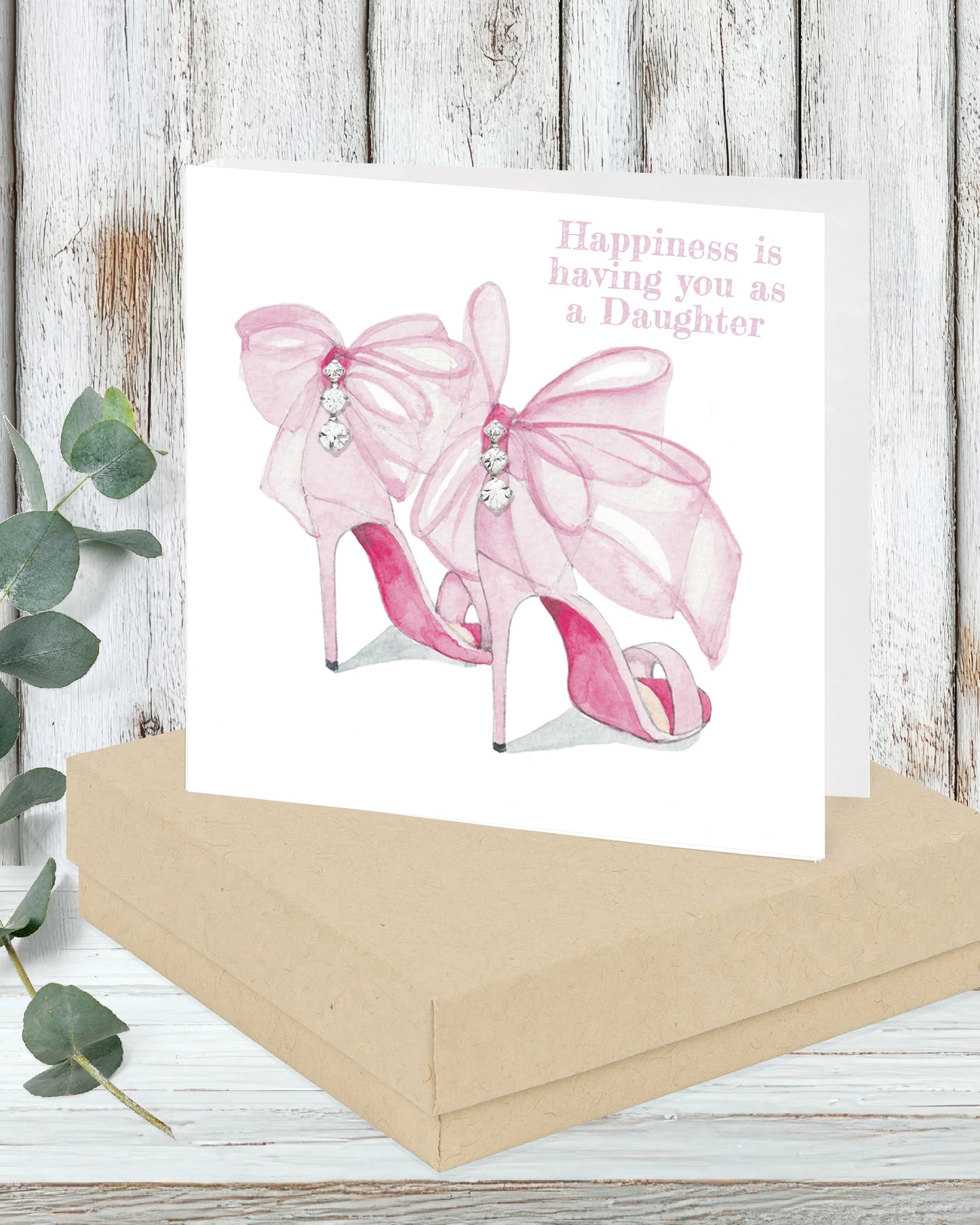 Handcrafted greeting card with pink high heels, bows, gems, and 'Happiness is having you as a Daughter' text.