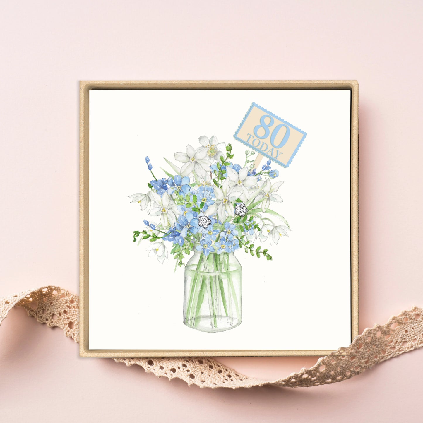 Boxed card with illustrated white and blue flowers in a jar and '80 Today' label.