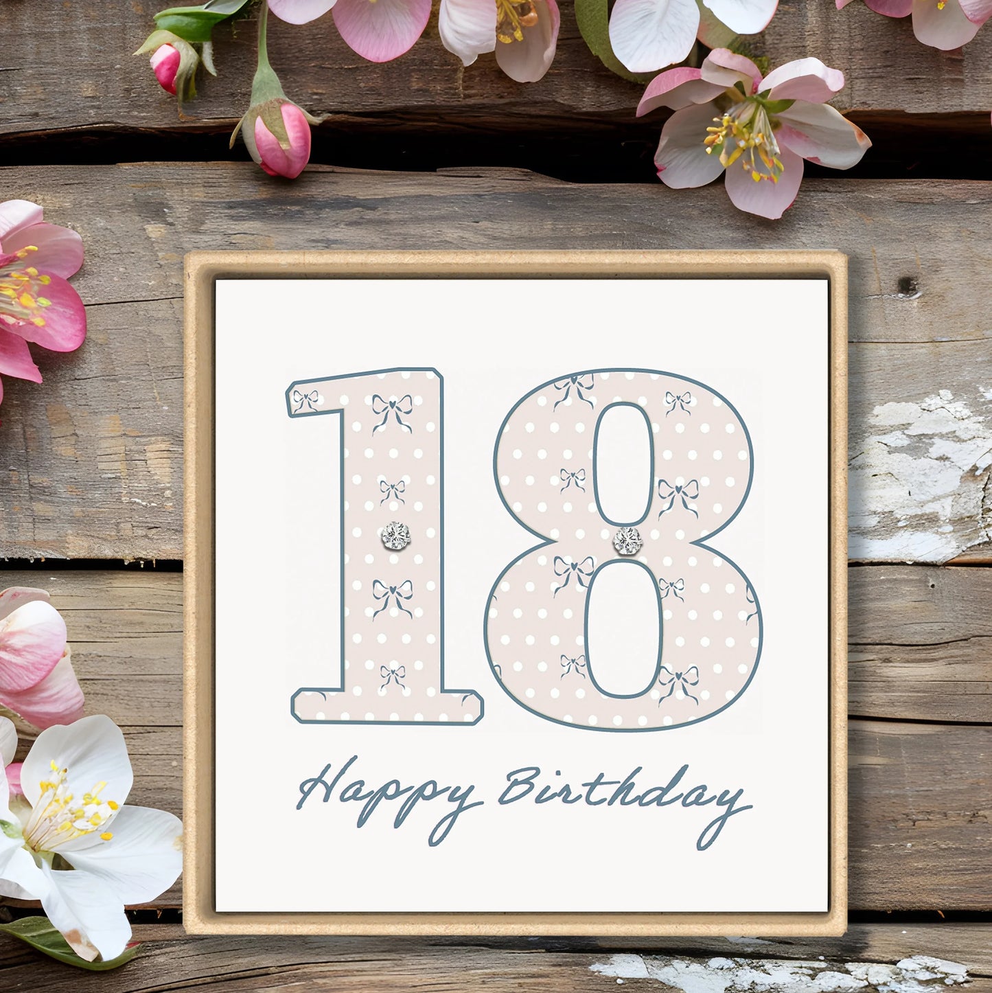 18th birthday card with polka dot and bow design, floral accents, rustic wood background