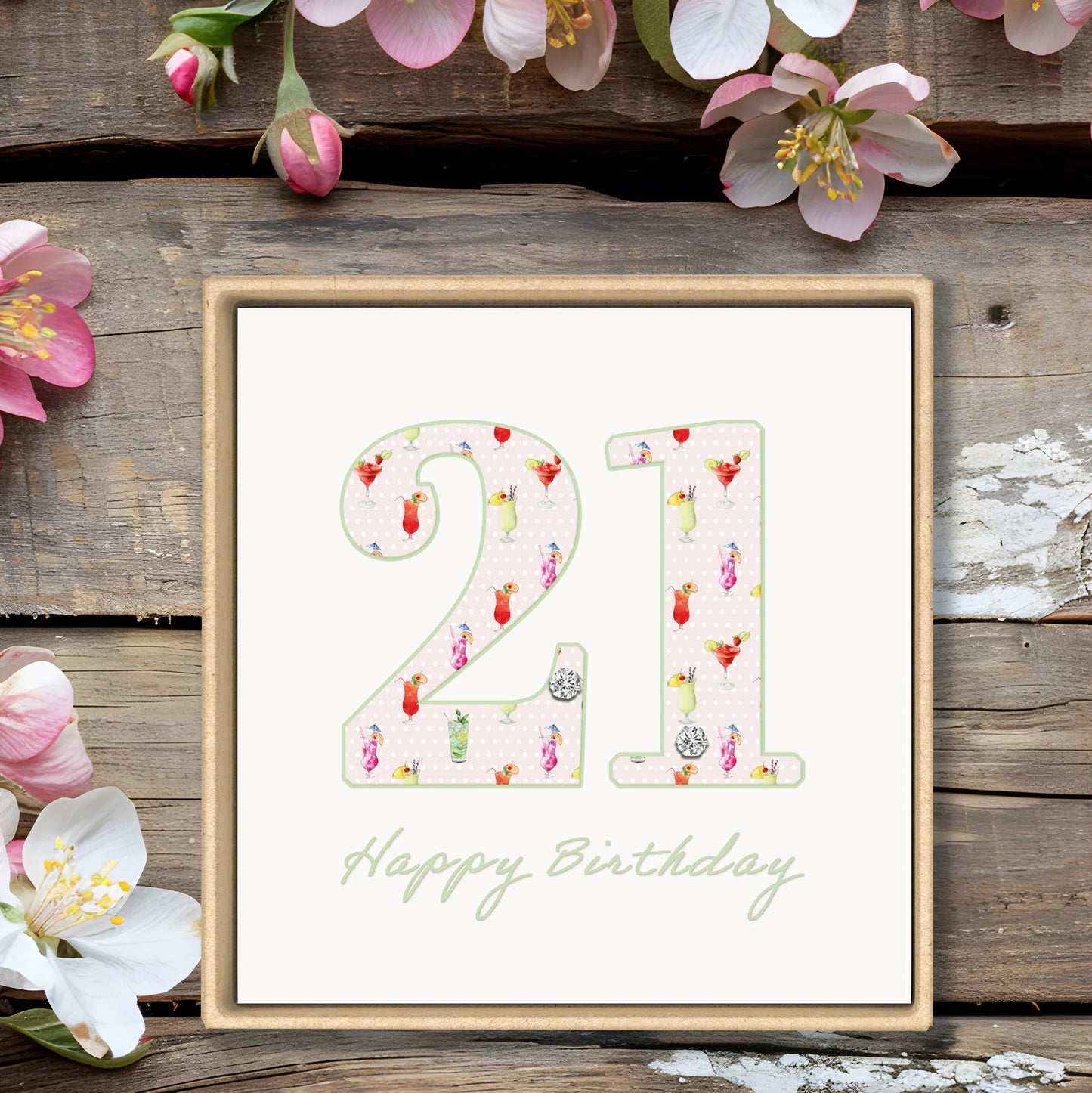 21st birthday card with floral decorations, wooden background, and 'Happy Birthday' text