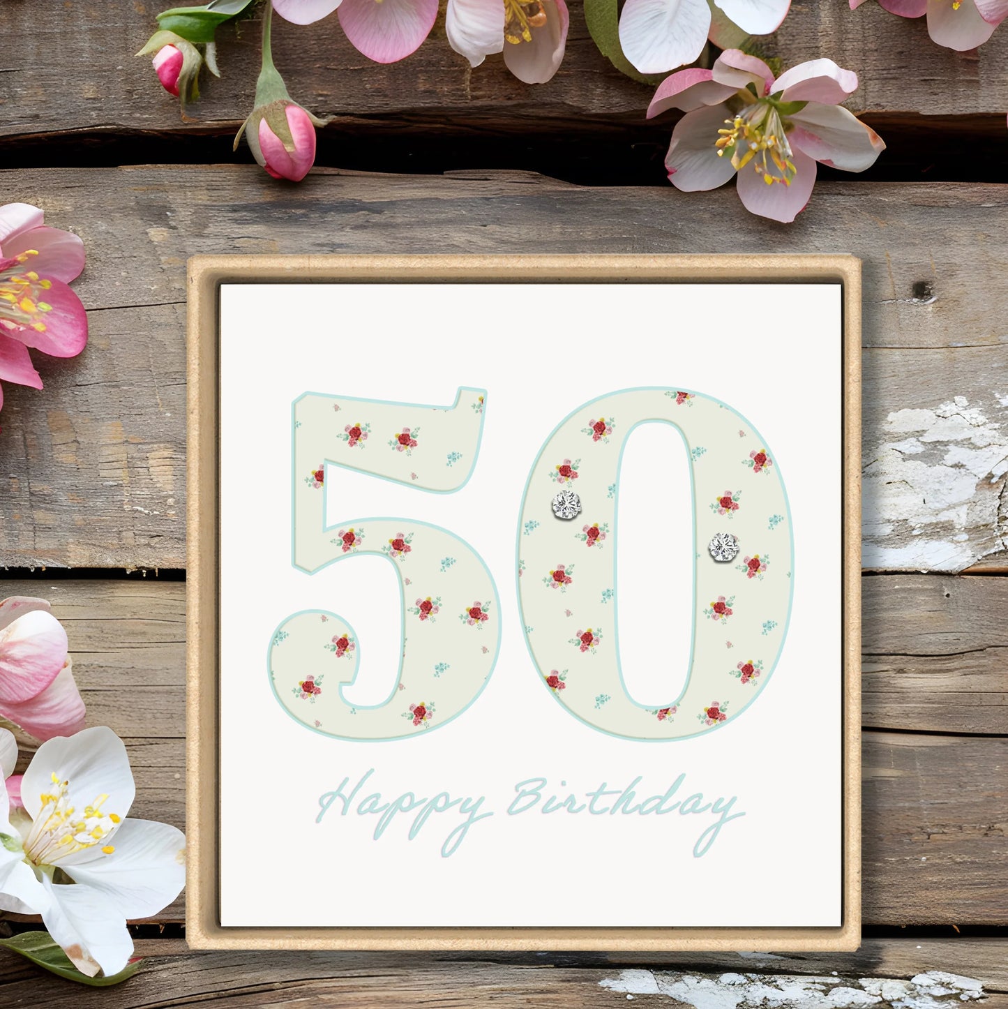 50th birthday floral greeting card with flowers on rustic wood background