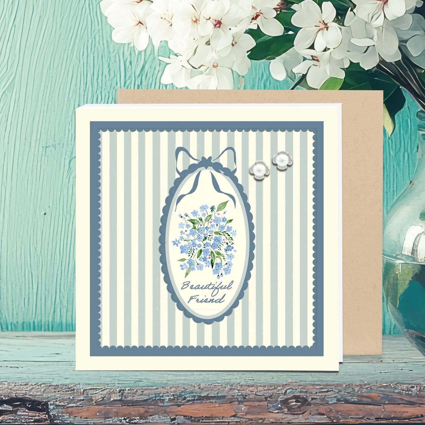 Greeting card with blue floral bouquet, striped pattern, 'Beautiful Friend' text, and pearl stud earrings
