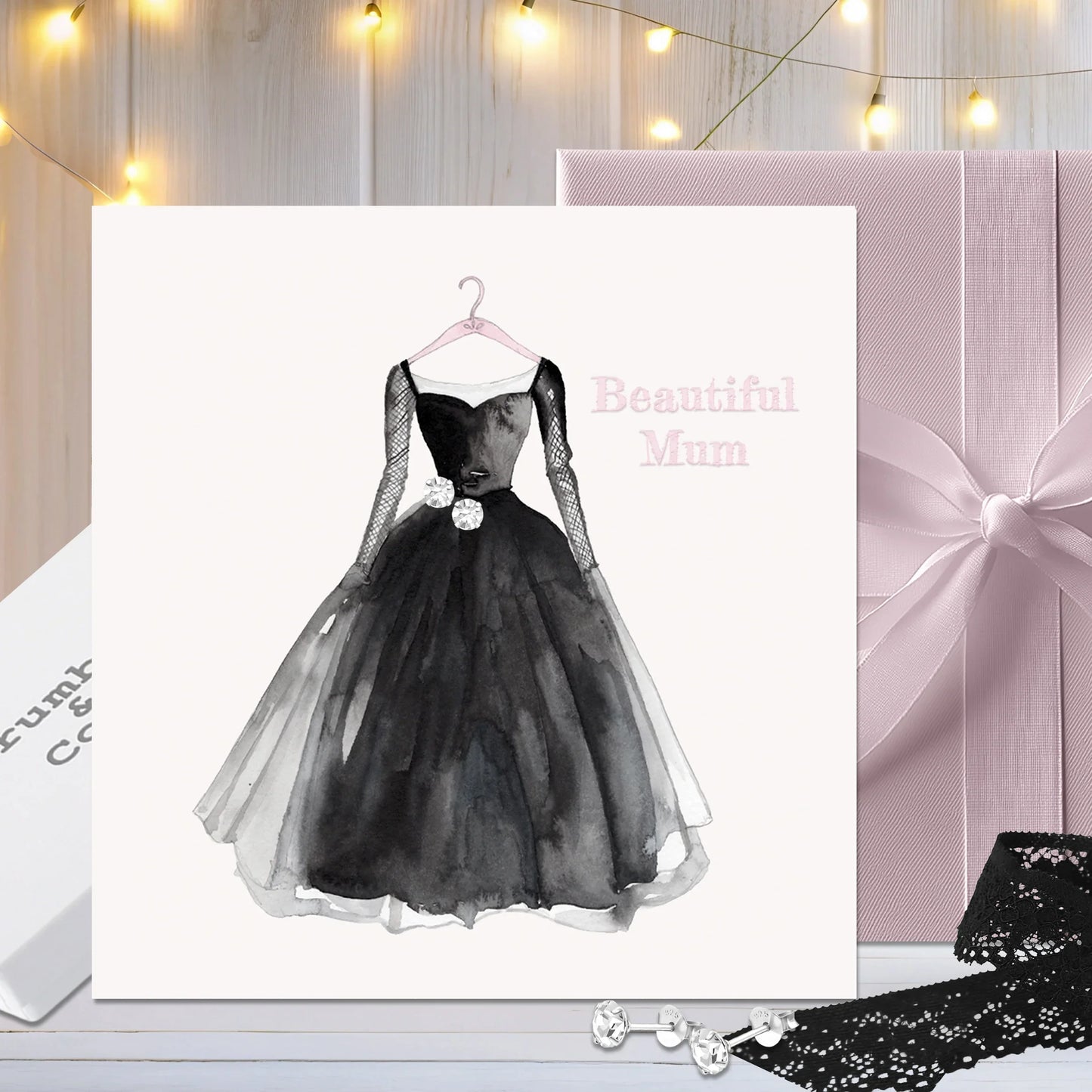 Elegant black dress illustrated on greeting card with Beautiful Mum text, gift and fairy lights