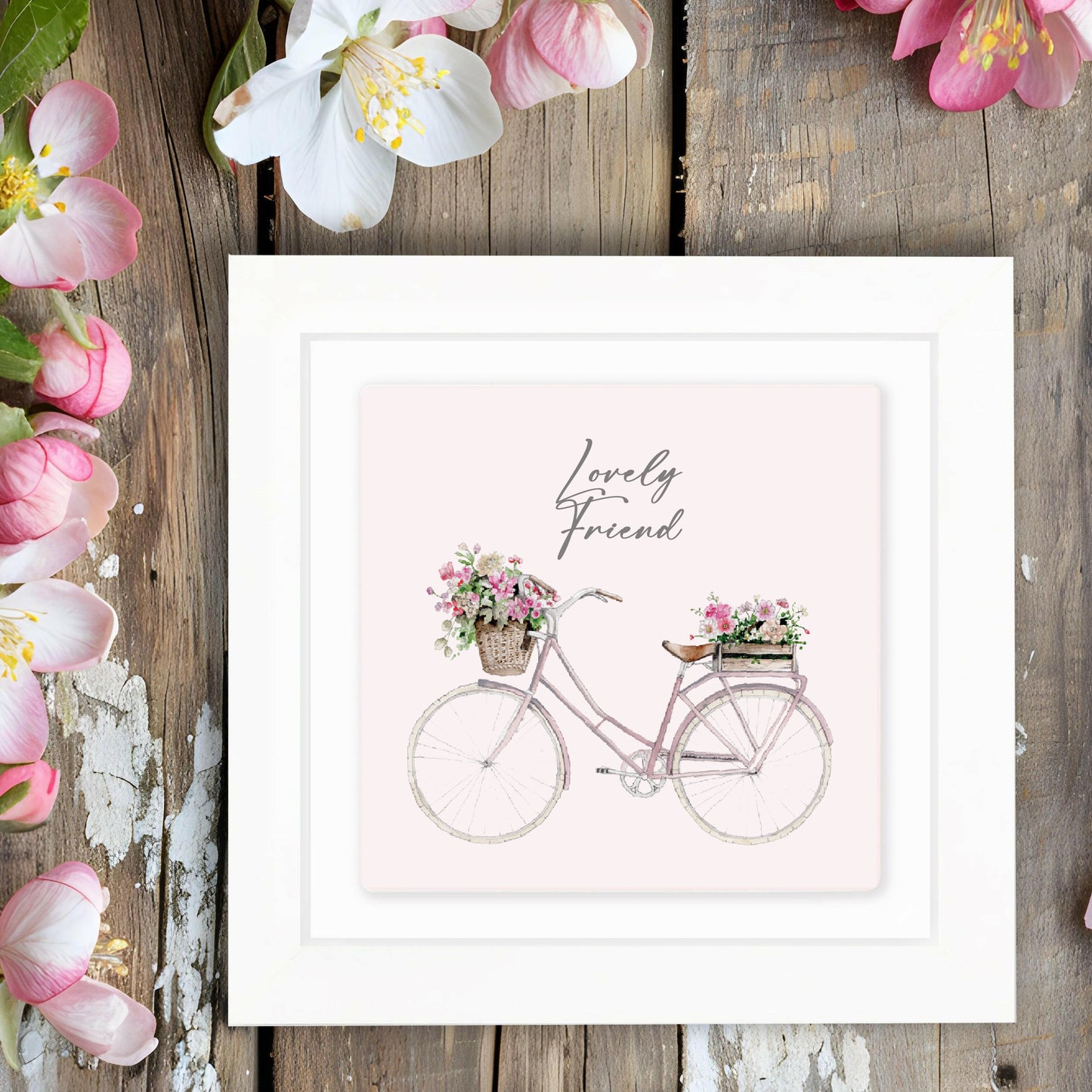 Framed card with pink bicycle and flower baskets, 'Lovely Friend' text, rustic floral setting