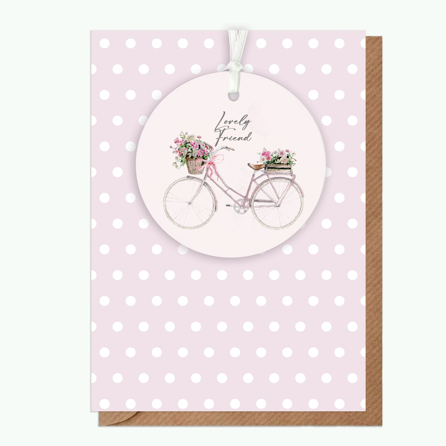 Lovely Friend card with pink bicycle, floral baskets, and polka dot background