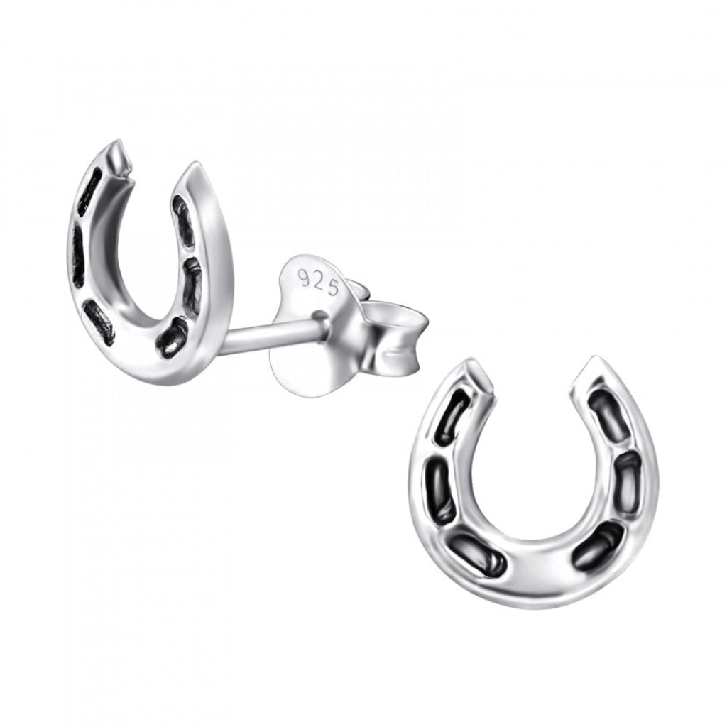 Silver horseshoe-shaped earrings on a white background