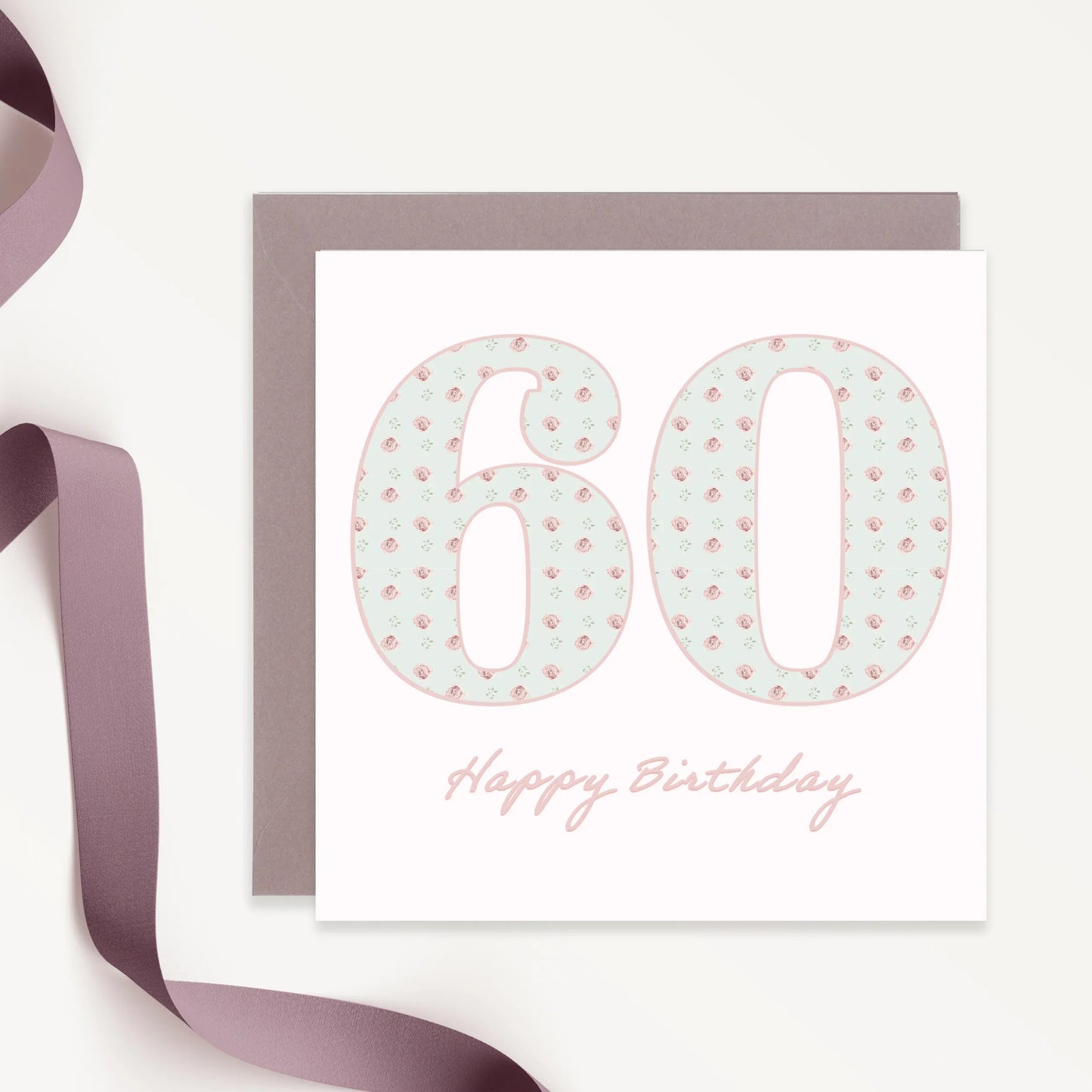 60th birthday card with floral patterned numbers, mauve envelope and ribbon, elegant design