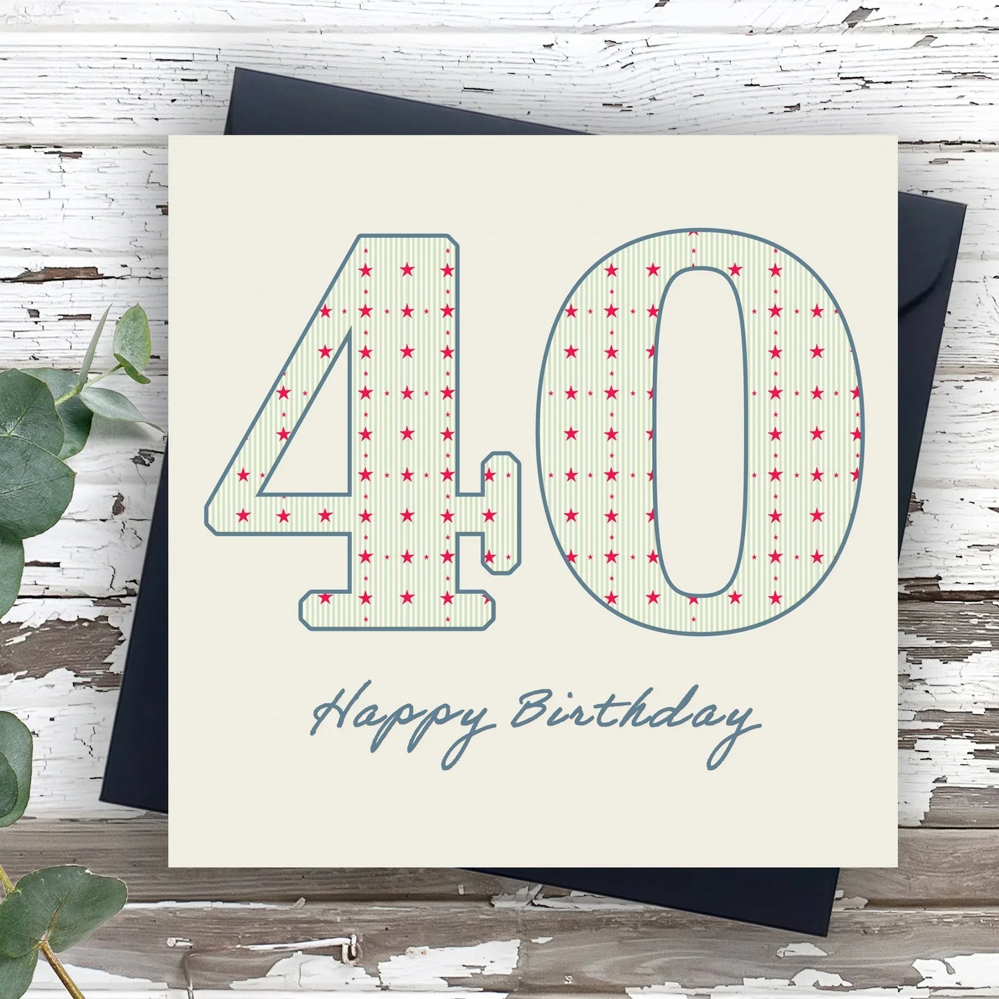 40th birthday card with star pattern and handwritten Happy Birthday text on rustic wood background